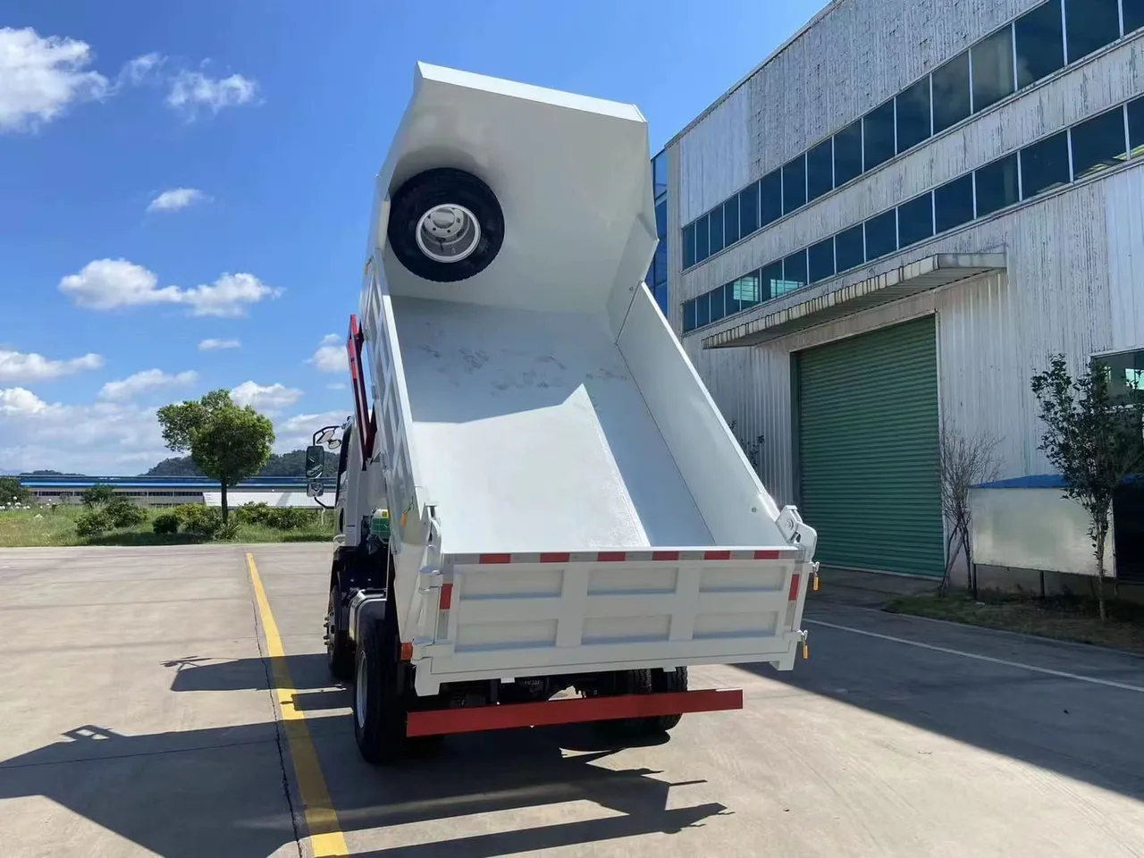 Used 8 ton tipper truck — red HOWO 4x2 light dump truck ready for export
