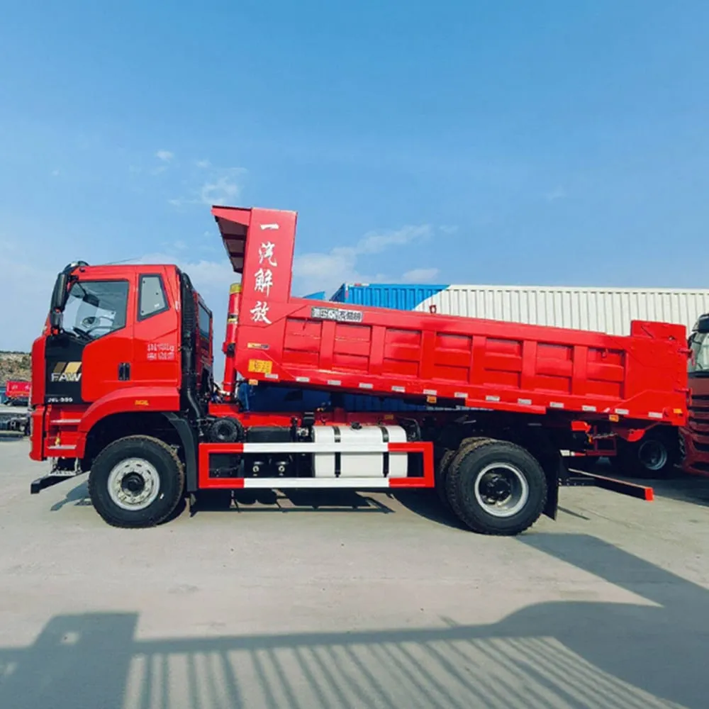 Mini dump truck with open tipping body on a construction site