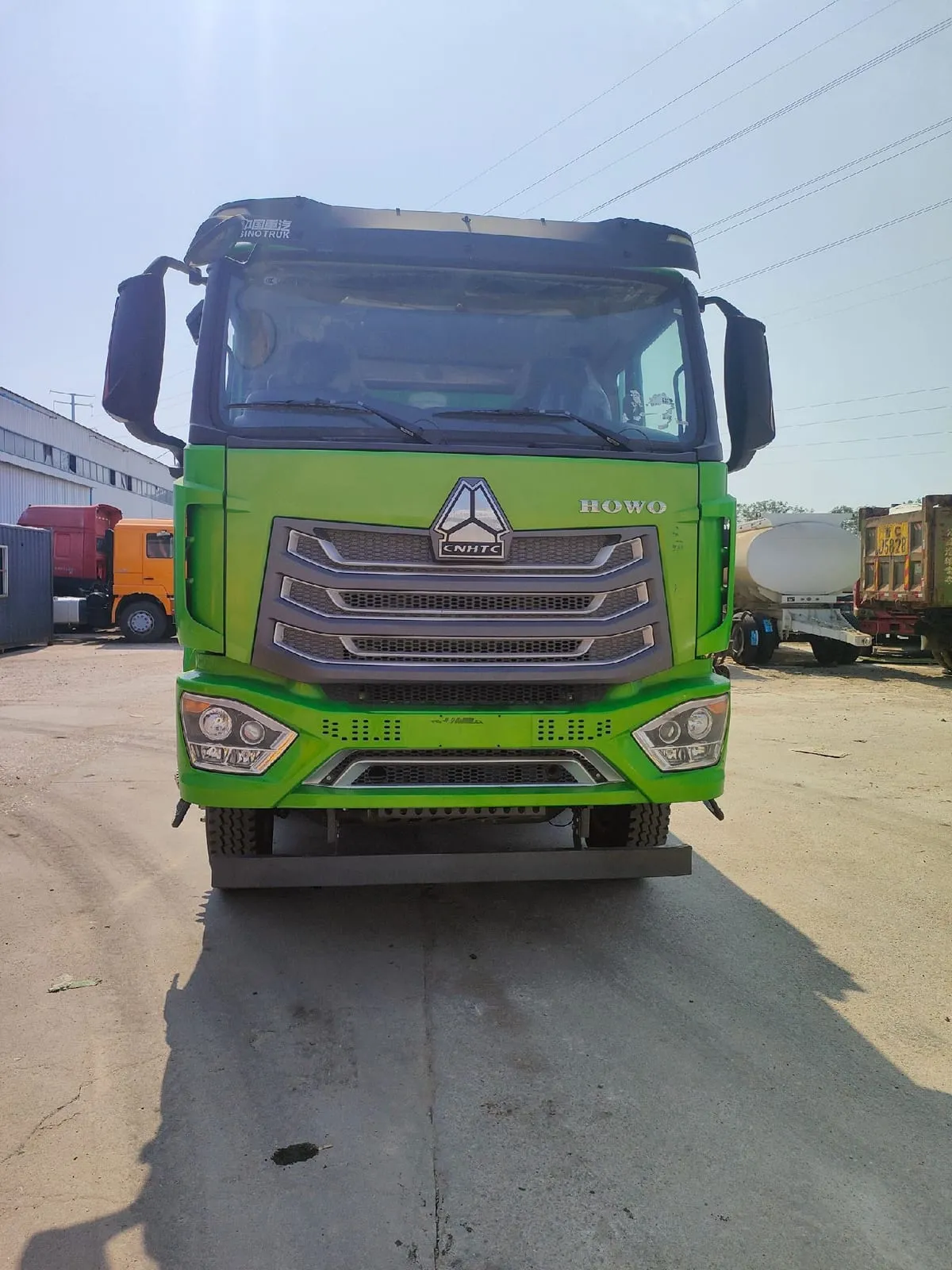 Used HOHAN 8x4 dump truck with raised tipper body, ready for export to Africa and Middle East